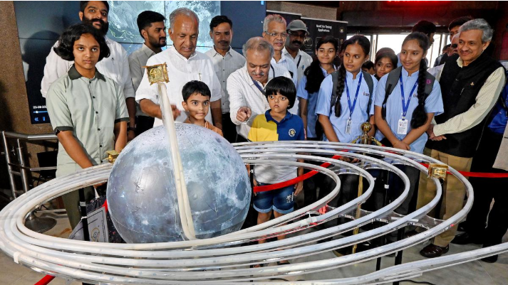 Karnataka Minister N. S. Boseraju accompanied by school students at Jawaharlal Nehru Planetarium, Bengaluru.