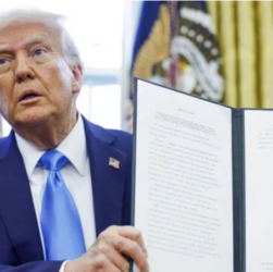 Trump displays a newly signed executive order.