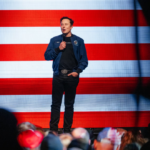 Elon Musk speaking during a video interview at the Qatar Economic Forum, 2025