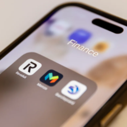 Smartphone screen displaying Revolut and Monzo app icons, representing popular fintech platforms affected by changing interest rates.