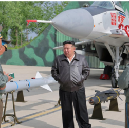 Kim Jong Un inspecting missiles during North Korean air drills at a military airfield, May 2025