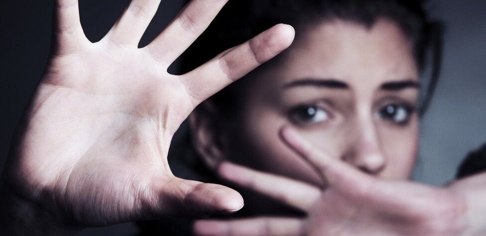 Handcuffs and legal documents on desk