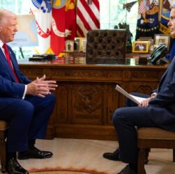 Donald Trump speaking at an event after criticizing U.S. television networks and calling for limits on media expansion.