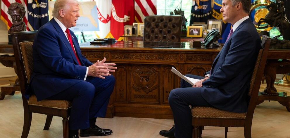 Donald Trump speaking at an event after criticizing U.S. television networks and calling for limits on media expansion.