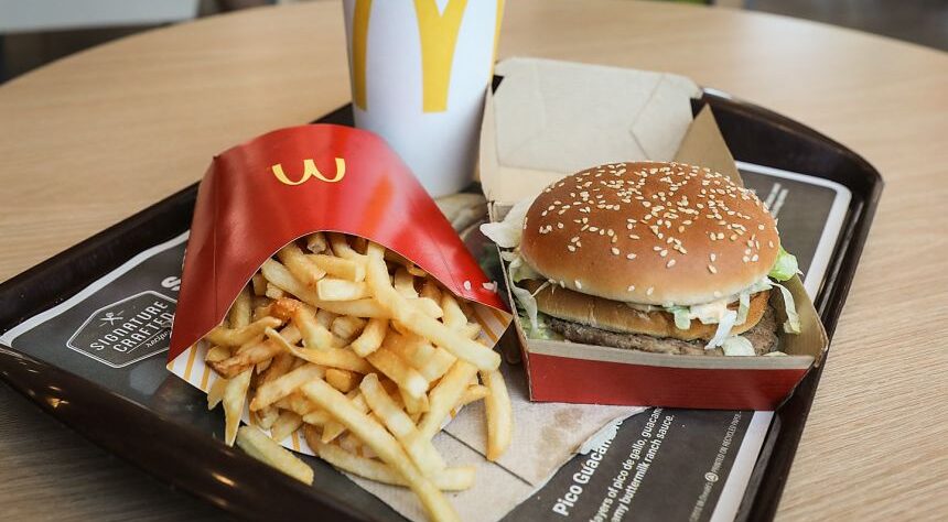 McDonald’s restaurant in Brazil decorated like the Upside Down from Stranger Things with retro arcade lights and themed menu.