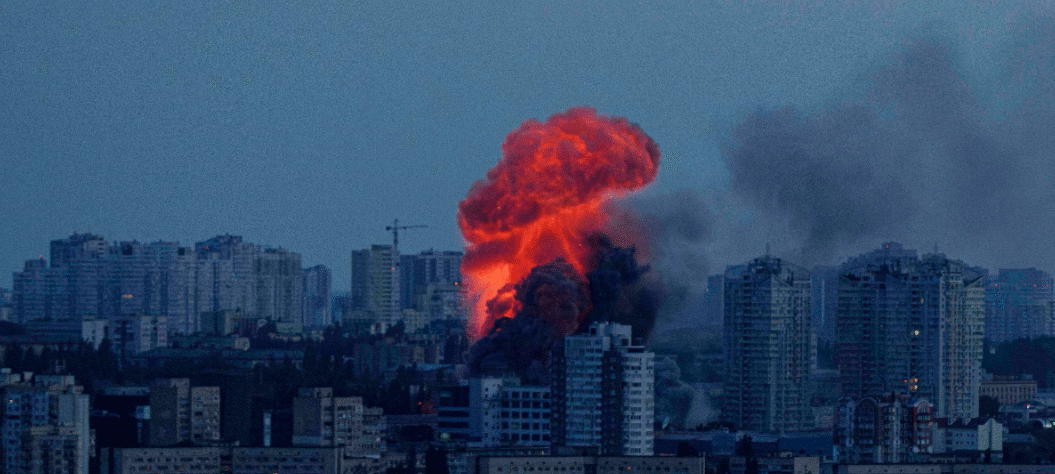 Emergency responders at a warehouse in Kyiv damaged by Russian drone and missile attacks during overnight strikes across Ukraine.