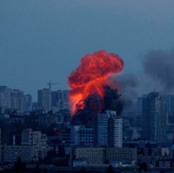 Emergency responders at a warehouse in Kyiv damaged by Russian drone and missile attacks during overnight strikes across Ukraine.