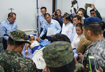 Injured Thai soldier being evacuated by military personnel after border clashes between Thailand and Cambodia in Sisaket province on December 7, 2025.
