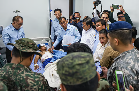 Injured Thai soldier being evacuated by military personnel after border clashes between Thailand and Cambodia in Sisaket province on December 7, 2025.