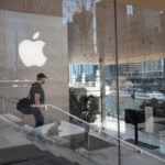 Apple CEO Tim Cook at a corporate event as the company faces a wave of top executive departures during a strategic shift toward AI leadership.