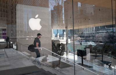 Apple CEO Tim Cook at a corporate event as the company faces a wave of top executive departures during a strategic shift toward AI leadership.