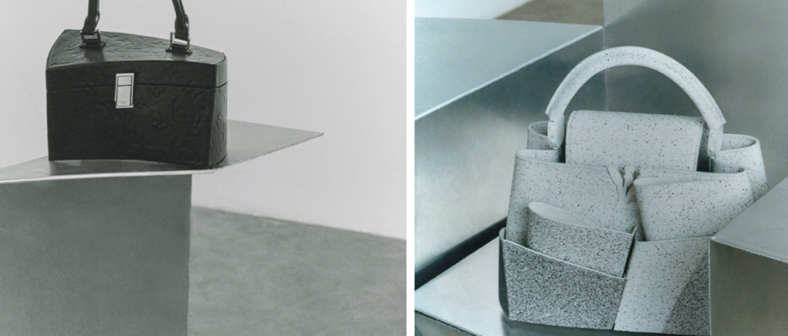 Frank Gehry at a museum opening with architectural models in hand