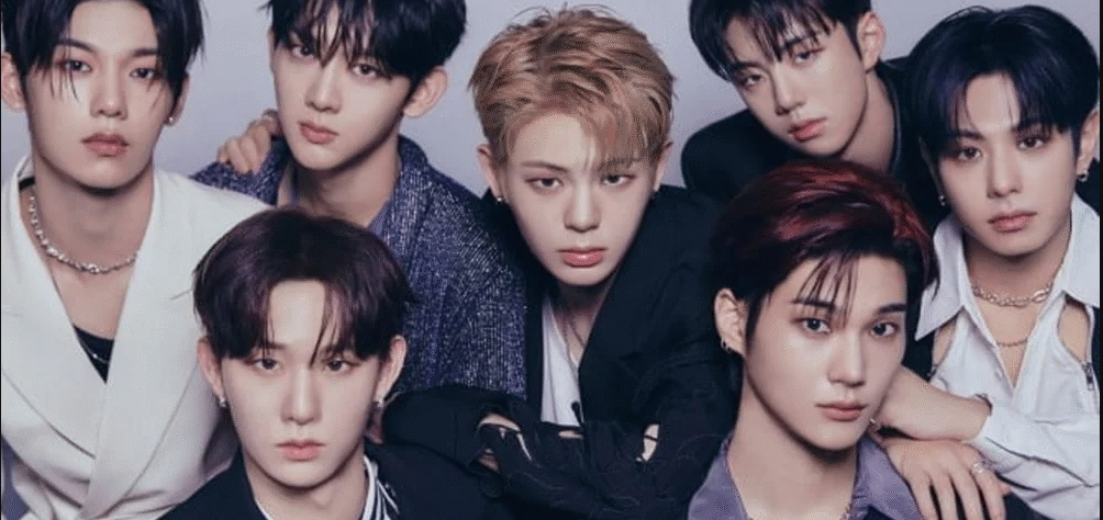 EVNNE K-pop group members performing on stage with Yoo Seungeon and Ji Yunseo leaving the group.