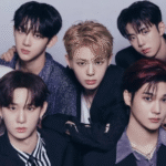 EVNNE K-pop group members performing on stage with Yoo Seungeon and Ji Yunseo leaving the group.