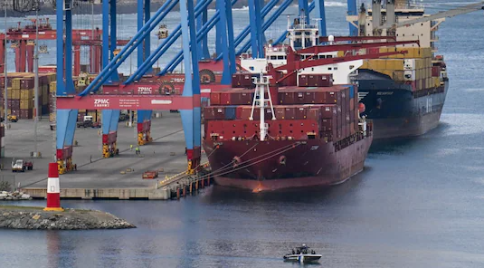 US special forces rappel onto oil tanker off the coast of Venezuela during seizure operation.