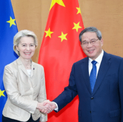 Chinese executives and bankers discussing overseas M&A deals, reflecting China Inc’s outbound investment revival in Europe.