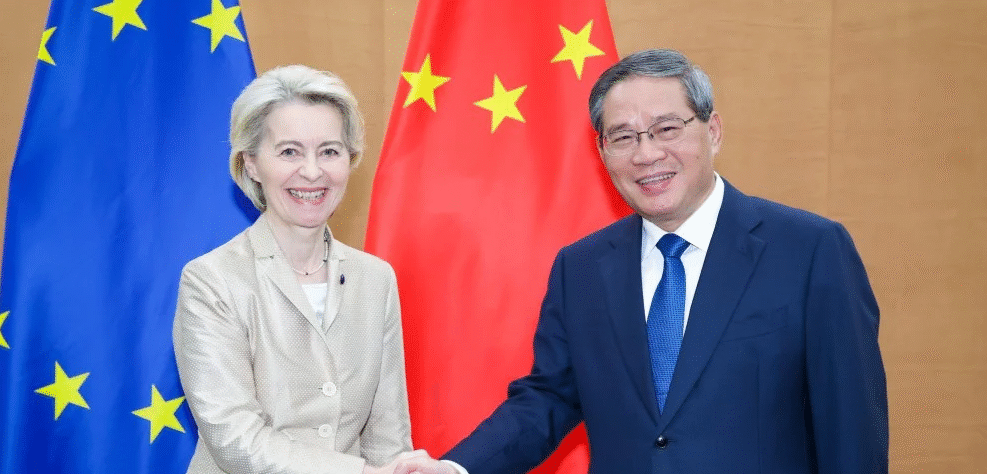 Chinese executives and bankers discussing overseas M&A deals, reflecting China Inc’s outbound investment revival in Europe.