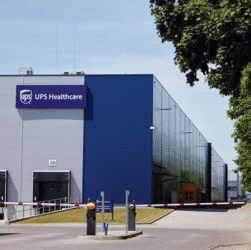 Trucks traveling on a major highway as analysts predict increased mergers and acquisitions in the trucking industry in 2026 due to lower interest rates.