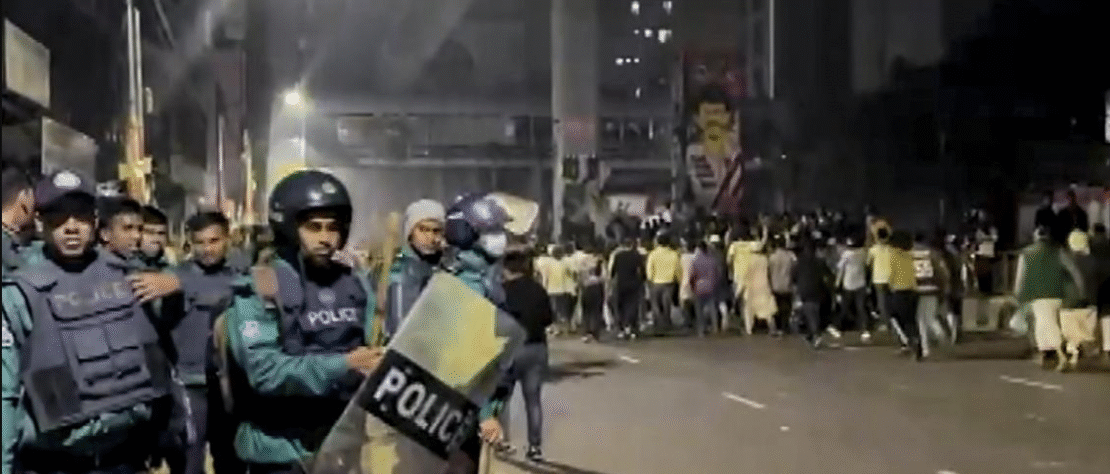 Bangladesh security personnel guard protesters after youth leader Sharif Osman Hadi was shot dead in Dhaka