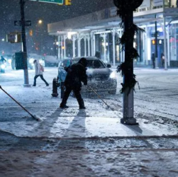 Snow-covered streets and icy trees during the post-Christmas winter storm in New York City, December 2025.