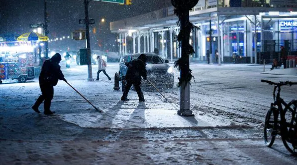 Snow-covered streets and icy trees during the post-Christmas winter storm in New York City, December 2025.