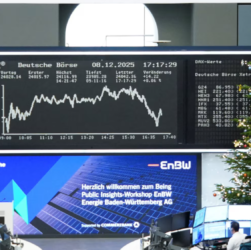 Photograph of the Frankfurt stock exchange floor with a Christmas tree and DAX graph in the background, symbolizing European shares climbing to records led by banks and commodities on December 30, 2025.
