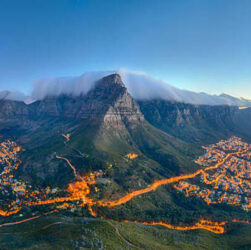 A luxury beachfront resort pool overlooking the ocean, representing high-end South African and international travel bookings during Black Friday.