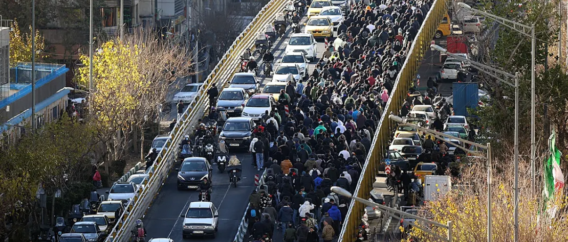 Protesters walk through central Tehran during nationwide demonstrations over economic conditions in Iran, December 2025.
