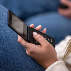 A person practicing mindful breathing in a calm, device-free environment, symbolizing somatic wellness and digital minimalism.